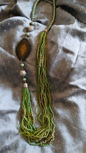 long beaded layered mala with large wood stone..
